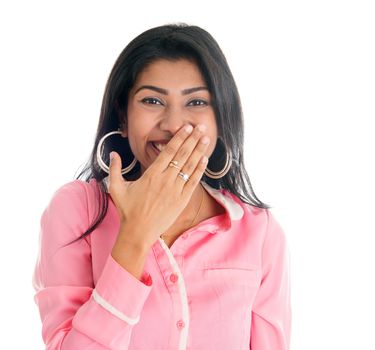 Indian woman giggles covering her mouth with hand, portrait of beautiful Asian female model isolated on white
