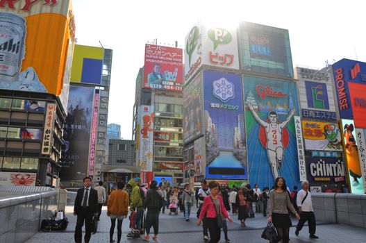 OSAKA, JAPAN - OCT 23: People visit famous Dotonbori street on October 23, 2012 in Osaka, Japan. According to Tripadvisor Dotonbori is the 3rd best attraction to visit in Osaka. 