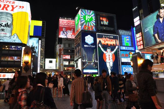 OSAKA, JAPAN - OCT 23: People visit famous Dotonbori street on October 23, 2012 in Osaka, Japan. According to Tripadvisor Dotonbori is the 3rd best attraction to visit in Osaka. 