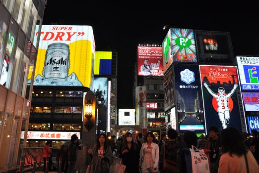 OSAKA, JAPAN - OCT 23: People visit famous Dotonbori street on October 23, 2012 in Osaka, Japan. According to Tripadvisor Dotonbori is the 3rd best attraction to visit in Osaka. 