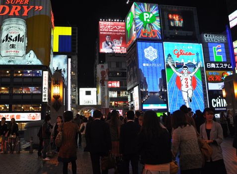 OSAKA, JAPAN - OCT 23: People visit famous Dotonbori street on October 23, 2012 in Osaka, Japan. According to Tripadvisor Dotonbori is the 3rd best attraction to visit in Osaka. 