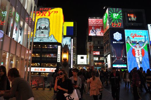 OSAKA, JAPAN - OCT 23: People visit famous Dotonbori street on October 23, 2012 in Osaka, Japan. According to Tripadvisor Dotonbori is the 3rd best attraction to visit in Osaka. 