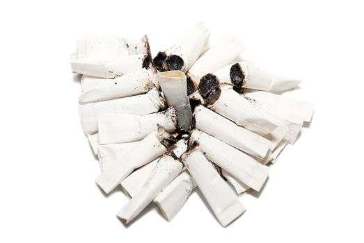 Close-up of cigarette butts on a white background.