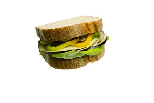 Veggie Sandwich made with lettuce, eggplant, yellow peppers and onion isolated on white background