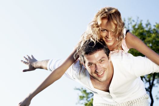 man and woman hug in the sky