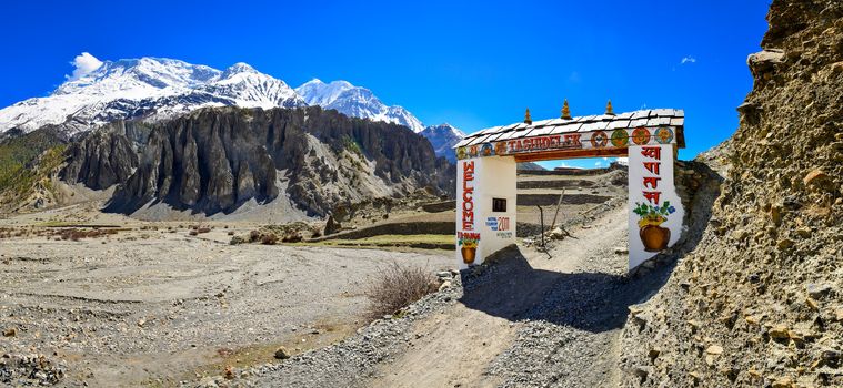 Panorama of entrance gate to Himalayas Manang village, Nepal