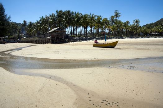 Boat on beach at low tide, Bang Tao, Phuket, Thailand