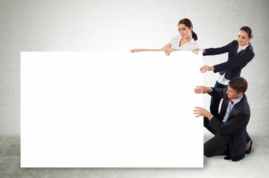 small group of people holding a blank banner, place for text