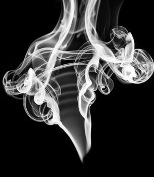 White abstract smoke or fume shape over black background