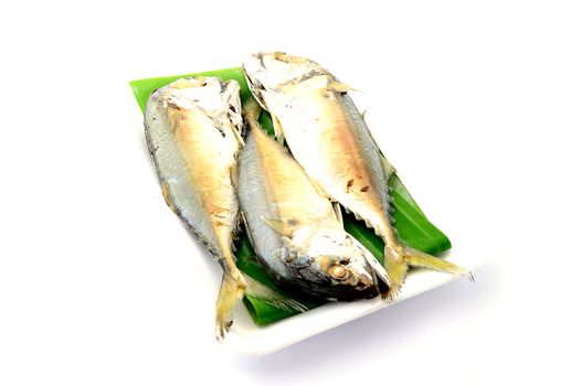 Chub mackerel on a banana leaf isolate on white background