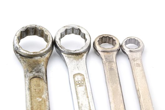 four old box wrenches isolate on white background