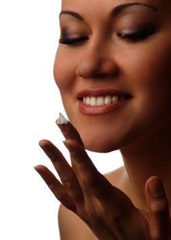 Photo of smiling model with cream for skin care