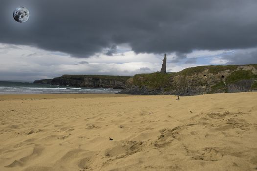 solitary person meditating on a golden beach in Ireland with castle in background in the full moonlight