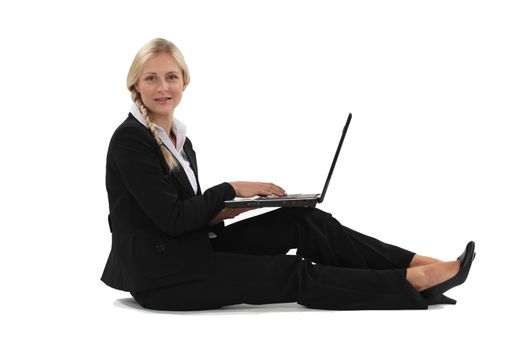 Blond businesswoman sat on the floor