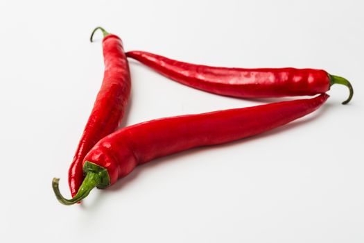 Red chili peppers on a white background