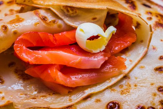 pancakes with smoked salmon and butter on the Shrovetide