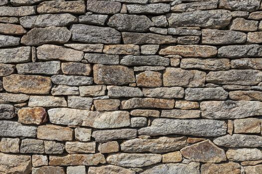 Close-up of a wall made by granite stones without cement, characteristic for constructions in Brittany in north-west of France.