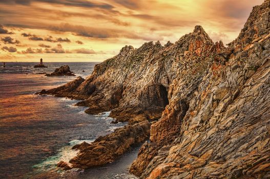 Beuatiful sunset on the Pointe du Raz located on Finistere coast in Brittany, north-west of France.This is the France's most westerly point.