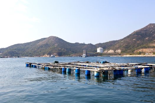 Fishing nets and boats on sea