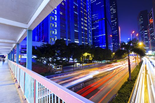 Traffic light through city at night