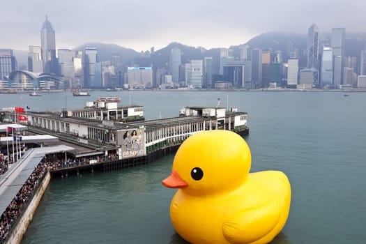 HONG KONG - MAY 6: The rubber duck swim in Victoria Harbour on May 6 2013. Giant 'Rubber Duck' Sculpture By Artist Florentijn Hofman, visit Hong Kong which draw the attention of local. 