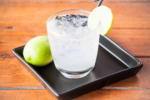 Glass of fresh homemade iced lemonade soda