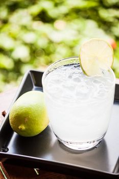 Fresh glass of iced lime juice with lime