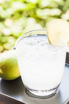 Full glass of fresh cool soda with lime