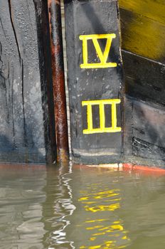 Depth Marker Detail on Wooden Boat