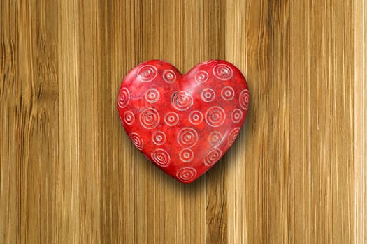 Photo of a red ornate heart on top of an old wood background.
