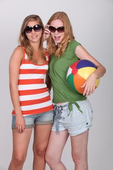 Two teenage girls dressed for summer fun