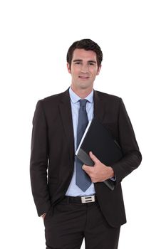 A businessman standing with his folder.