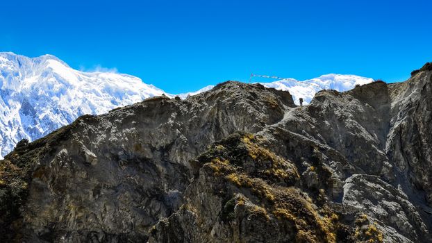 Silhouette of mountain trekker in Himalayas rocky mountains