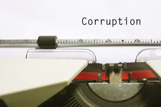 corruption concepts, with message on typewriter paper.