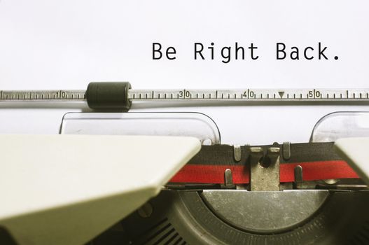 be right back concepts, with message on typewriter. For website maintenance message.