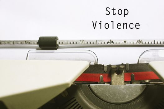 stop violence concept, with message on typewriter paper.