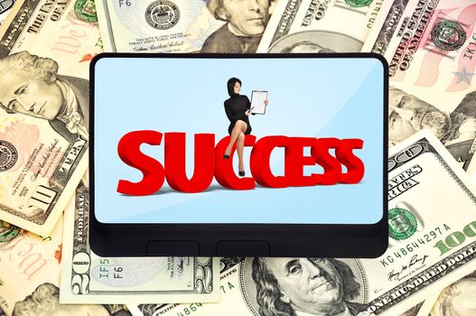 digital tablet with success symbol on background of dollars