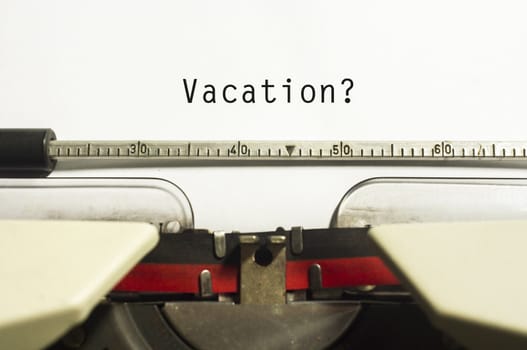 concepts of vacations from work, with message on typewriter.