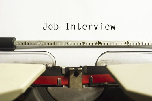 concept of job interview, with message on typewriter.