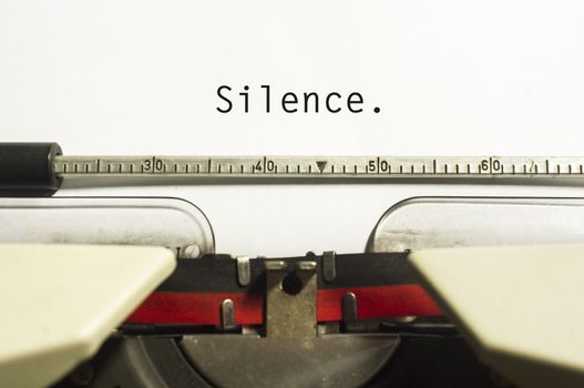 silence message is typed on typewriter, for conceptual background.