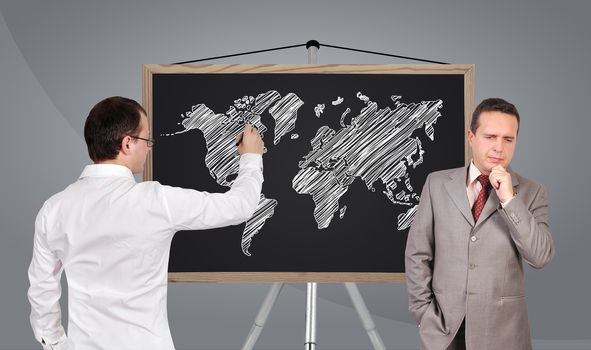 two businessman and world map on blackboard
