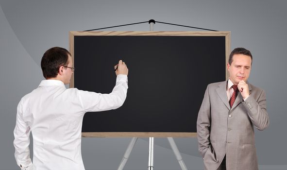 two businessman and and blank blackboard