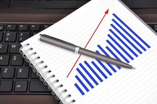 drawing chart in notebook and laptop