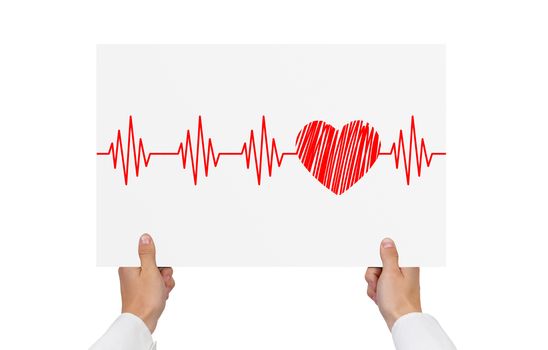 hands holding paper with cardiogram