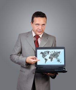 man with laptop and world map on screen