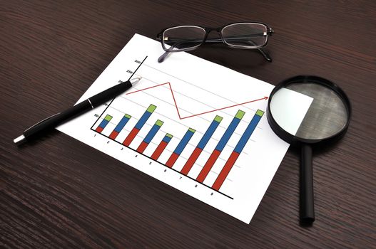 workplace with growth chart on paper