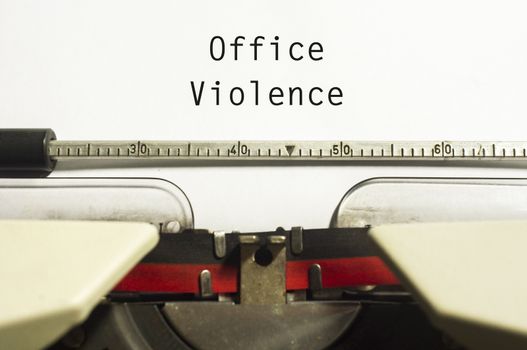 office or workplace violence, with message on typewriter paper.