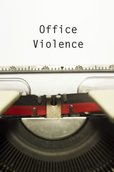 office or workplace violence, with message on typewriter paper.