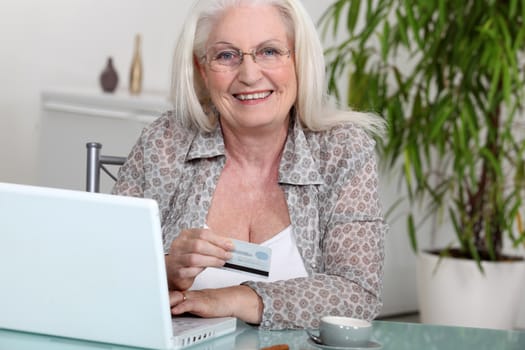 Senior woman paying online