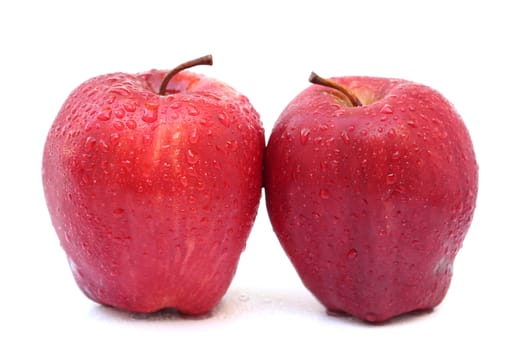 Close up two red apples isolated on white background